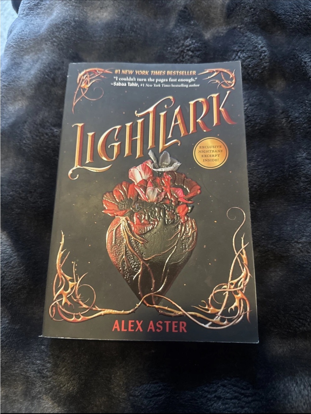 Lightlark Paperback Book - Black Cover with Red Accents